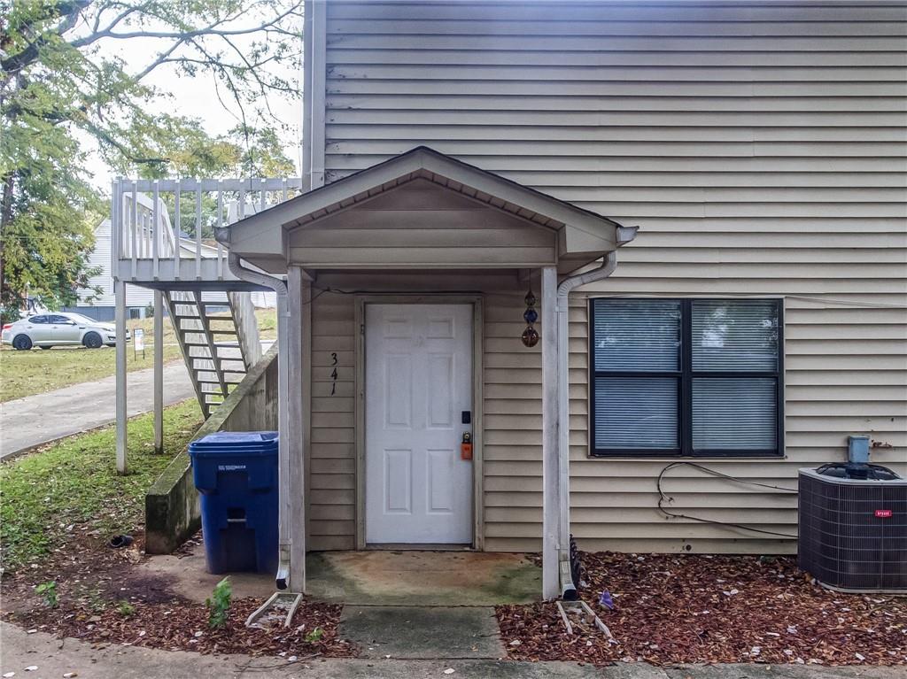 341 West Griffin Street, Unit C Dallas, GA 30132 - Photo 18 of 19 a view of a house with a door and wooden walls