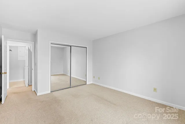 an empty room with sliding glass door