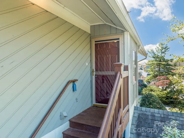 a view of stairs and potted plants