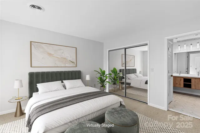 a bedroom with a large bed and a couch