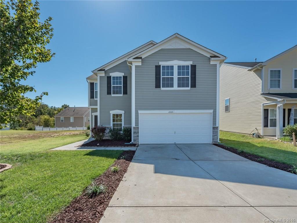 2226 Durand Road Fort Mill, SC 29715 - Photo 1 of 24 a front view of a house with a yard