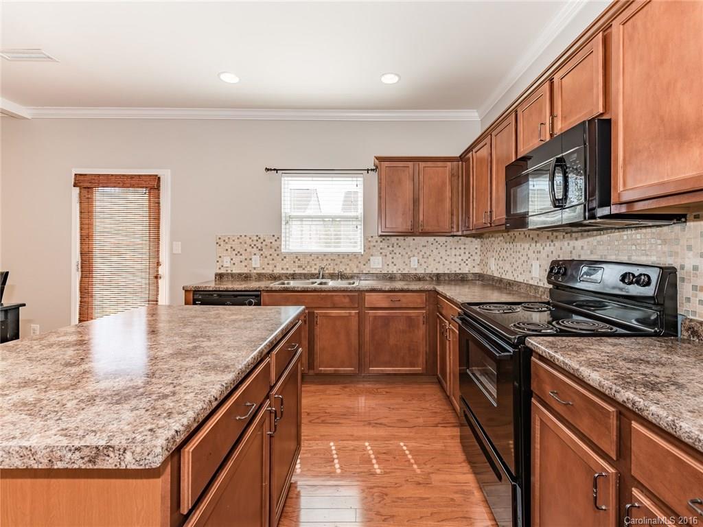 2226 Durand Road Fort Mill, SC 29715 - Photo 11 of 24 a kitchen with stainless steel appliances granite countertop a stove a sink and a microwave