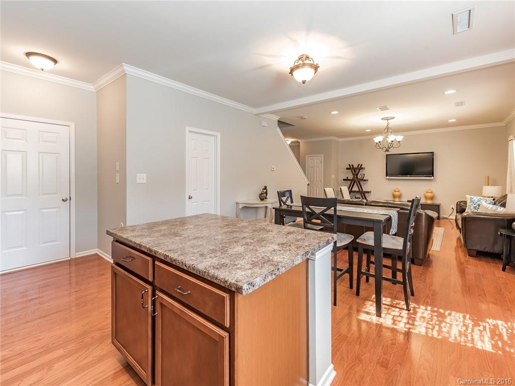 2226 Durand Road Fort Mill, SC 29715 - Photo 14 of 24 a kitchen with a table chairs refrigerator and cabinets