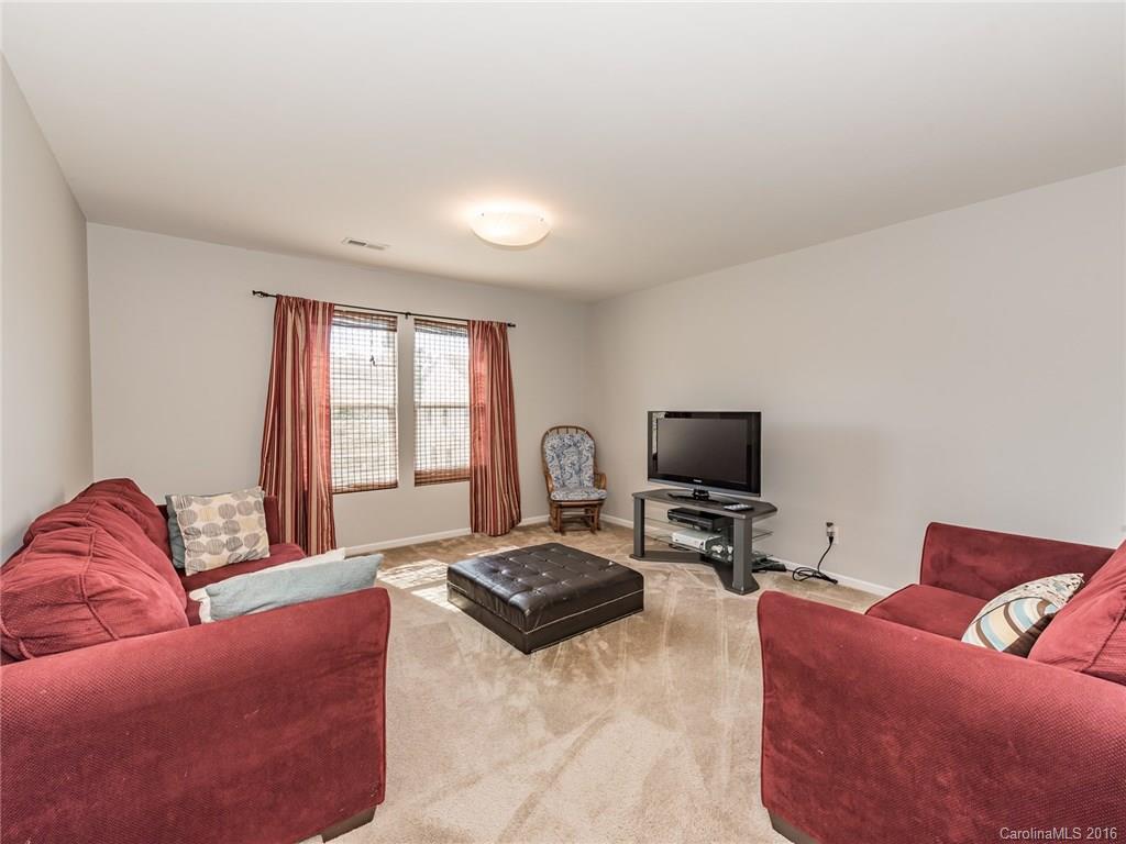 2226 Durand Road Fort Mill, SC 29715 - Photo 16 of 24 a living room with furniture and a flat screen tv