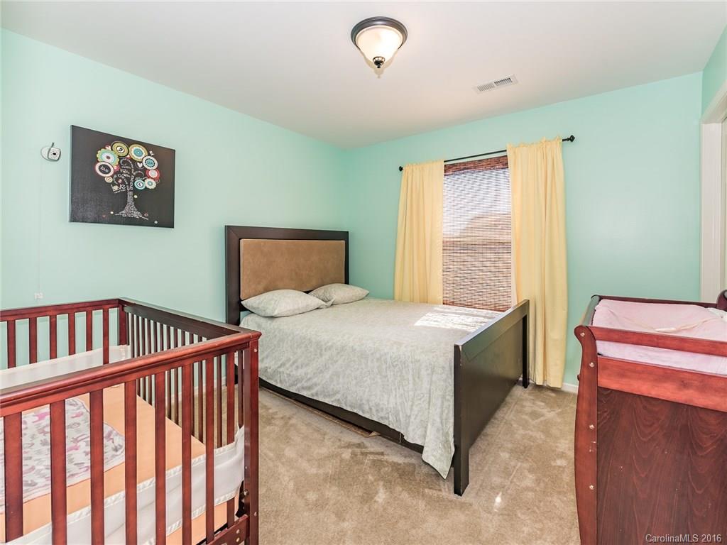 2226 Durand Road Fort Mill, SC 29715 - Photo 17 of 24 a bedroom with a bed and a window