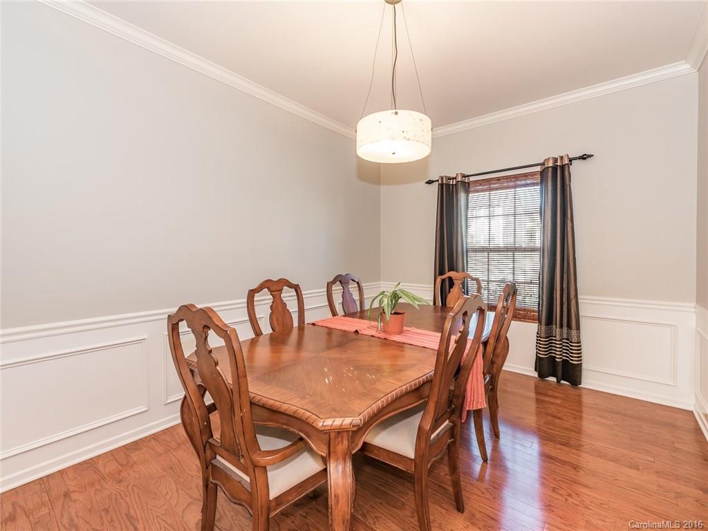 2226 Durand Road Fort Mill, SC 29715 - Photo 3 of 24 a view of a dining room with furniture wooden floor and chandelier