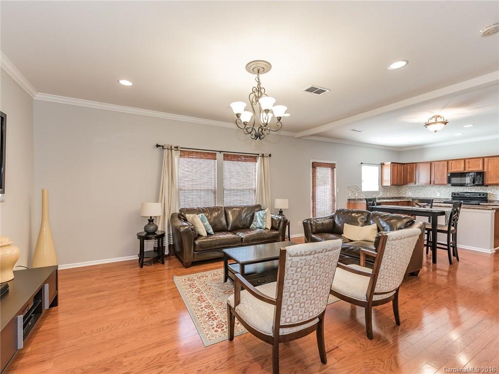 2226 Durand Road Fort Mill, SC 29715 - Photo 5 of 24 a living room with fireplace furniture and a flat screen tv
