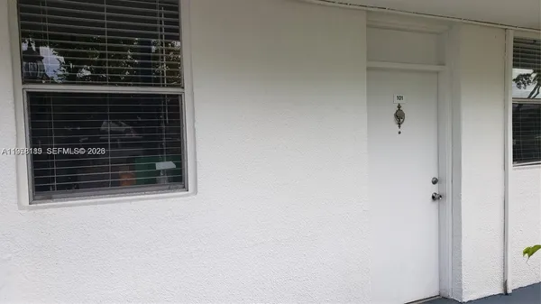 a view of kitchen cabinetry and a sink