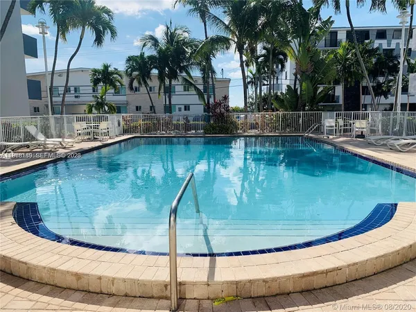 a view of a swimming pool with a sitting area