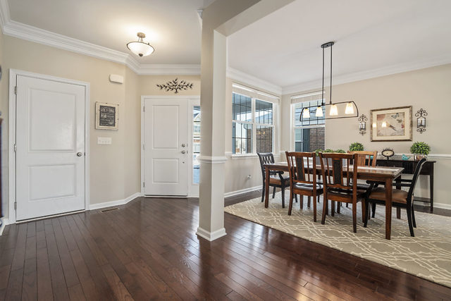 1244 Falcon Ridge Drive Elgin, IL 60124 - Photo 2 of 23 a view of a dining room with furniture window and wooden floor