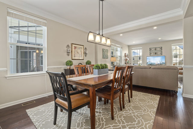 1244 Falcon Ridge Drive Elgin, IL 60124 - Photo 11 of 23 a view of a dining room with furniture and wooden floor
