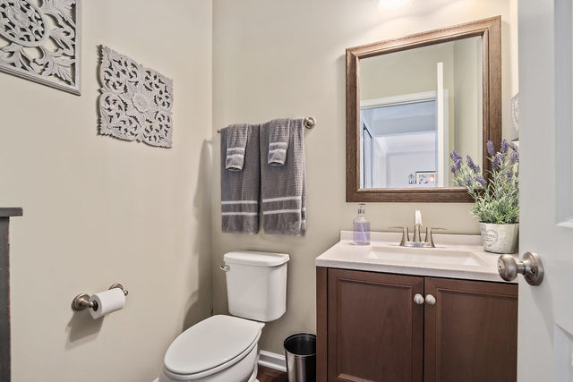 1244 Falcon Ridge Drive Elgin, IL 60124 - Photo 12 of 23 a bathroom with a toilet sink vanity and mirror