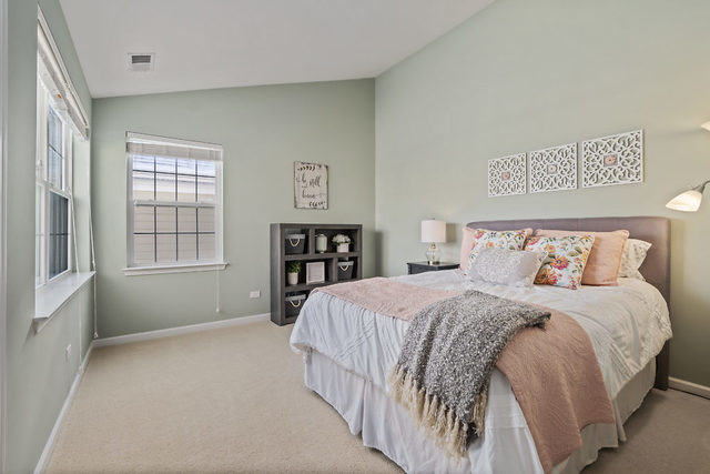 1244 Falcon Ridge Drive Elgin, IL 60124 - Photo 18 of 23 a bedroom with a bed and a window