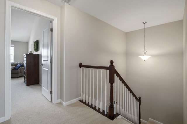 1244 Falcon Ridge Drive Elgin, IL 60124 - Photo 20 of 23 a view of a hallway with closet and a livingroom