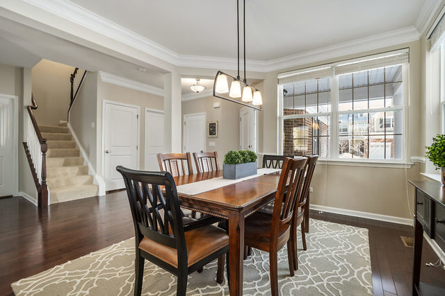 1244 Falcon Ridge Drive Elgin, IL 60124 - Photo 10 of 23 a view of a dining room with furniture window and wooden floor