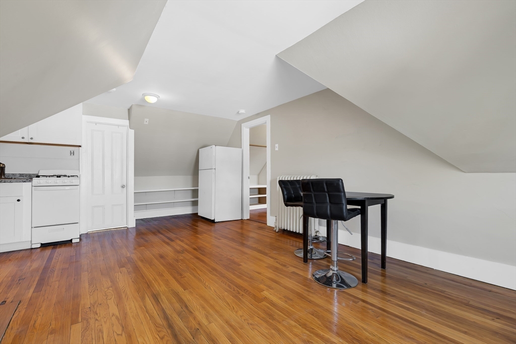 28 Evergreen Street, Unit 3 Boston, MA 02130 - Photo 5 of 16 a view of a workspace with furniture and wooden floor