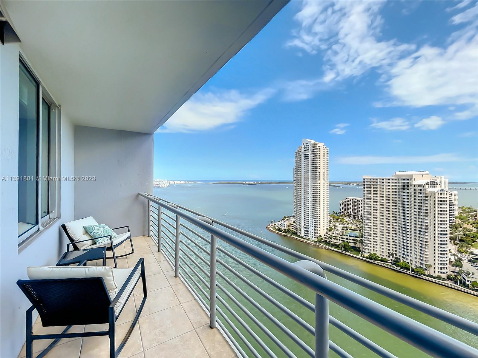 335 South Biscayne Boulevard, Unit 3103 Miami, FL 33131 - Photo 1 of 35 a view of a balcony with chairs
