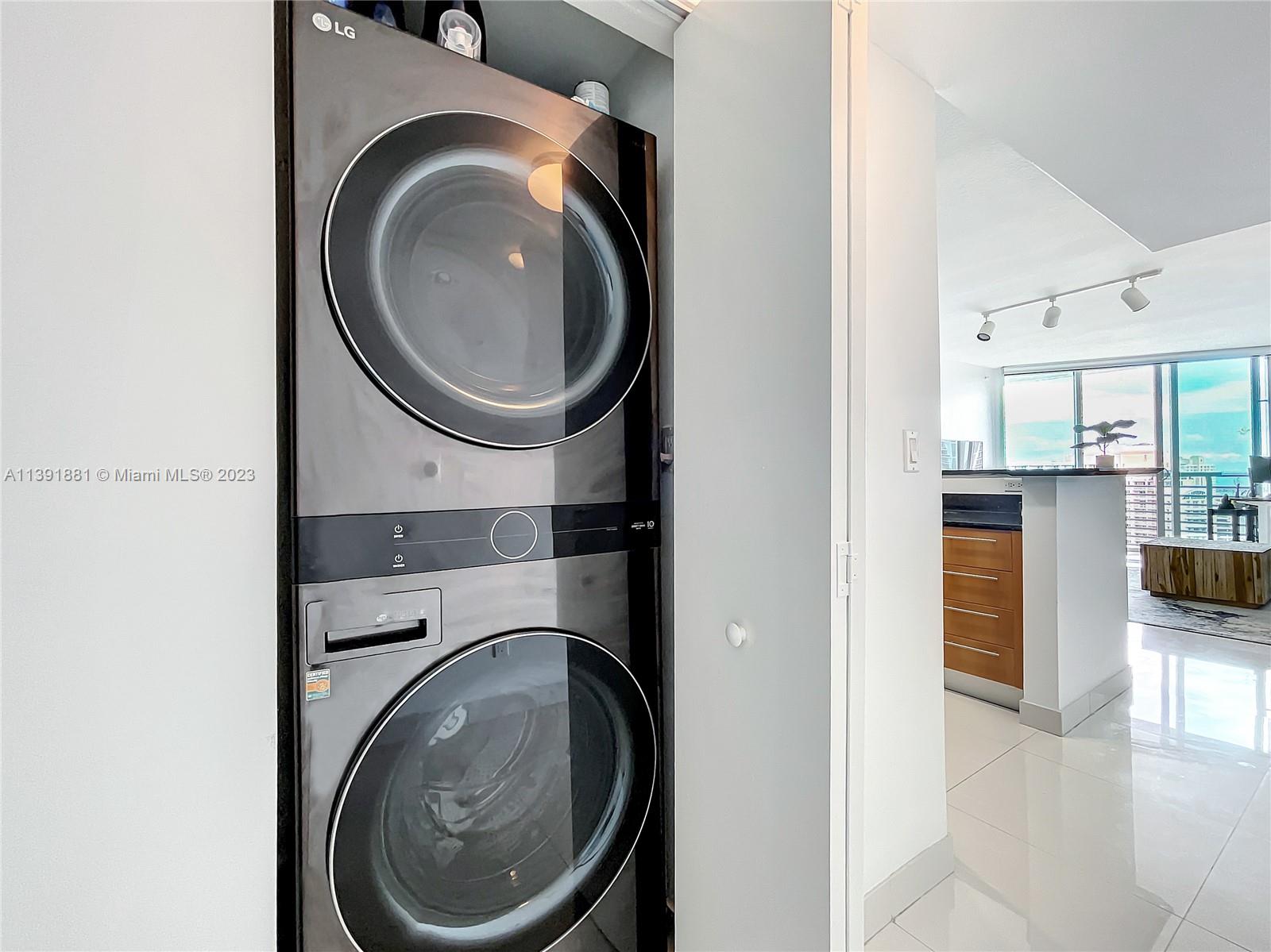 335 South Biscayne Boulevard, Unit 3103 Miami, FL 33131 - Photo 17 of 35 a close view of a utility room with washer and dryer
