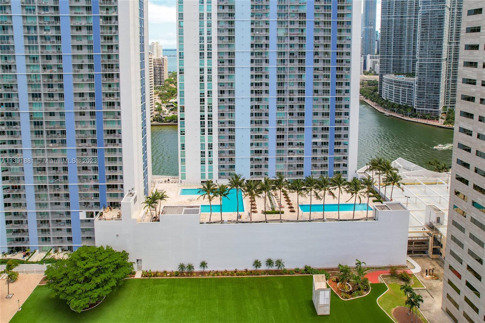 335 South Biscayne Boulevard, Unit 3103 Miami, FL 33131 - Photo 18 of 35 a view of building and yard with swimming pool