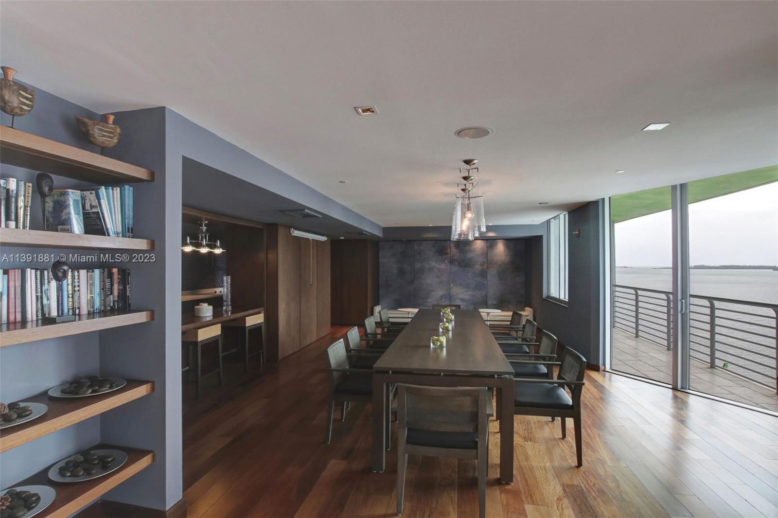 335 South Biscayne Boulevard, Unit 3103 Miami, FL 33131 - Photo 29 of 35 a view of a dining room with furniture window and wooden floor