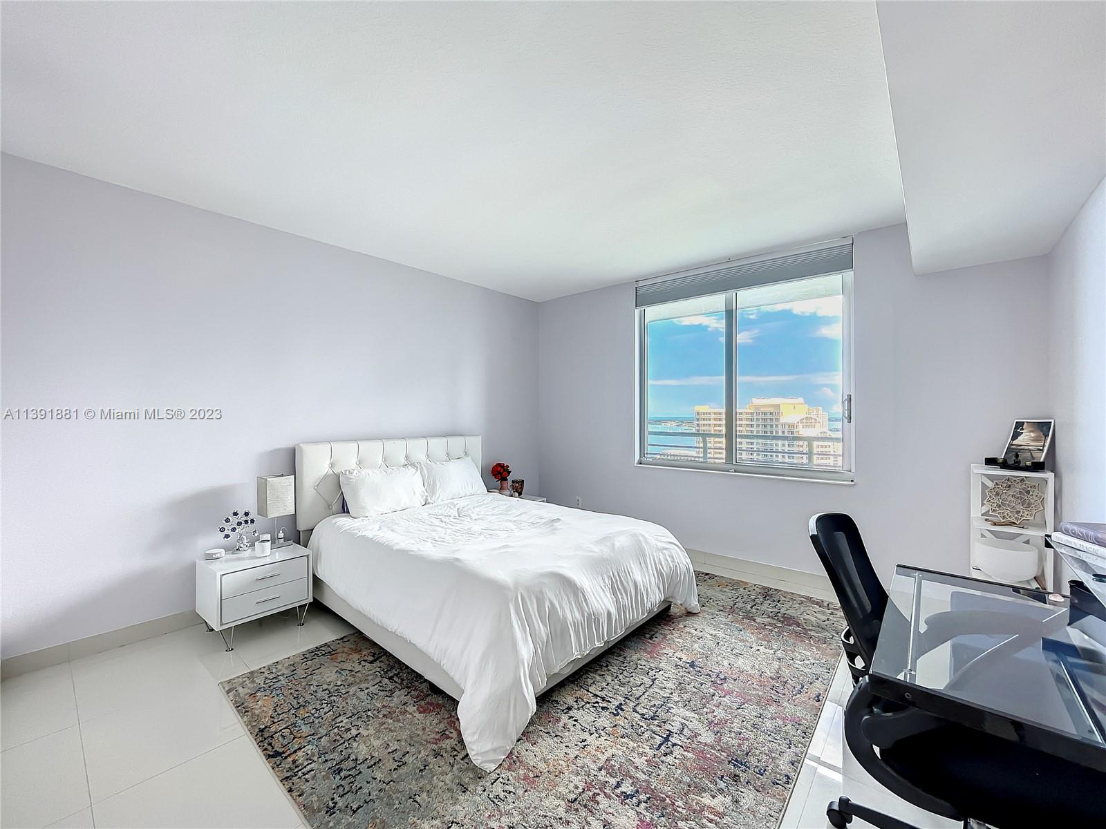 335 South Biscayne Boulevard, Unit 3103 Miami, FL 33131 - Photo 10 of 35 a bedroom with a bed and a desk