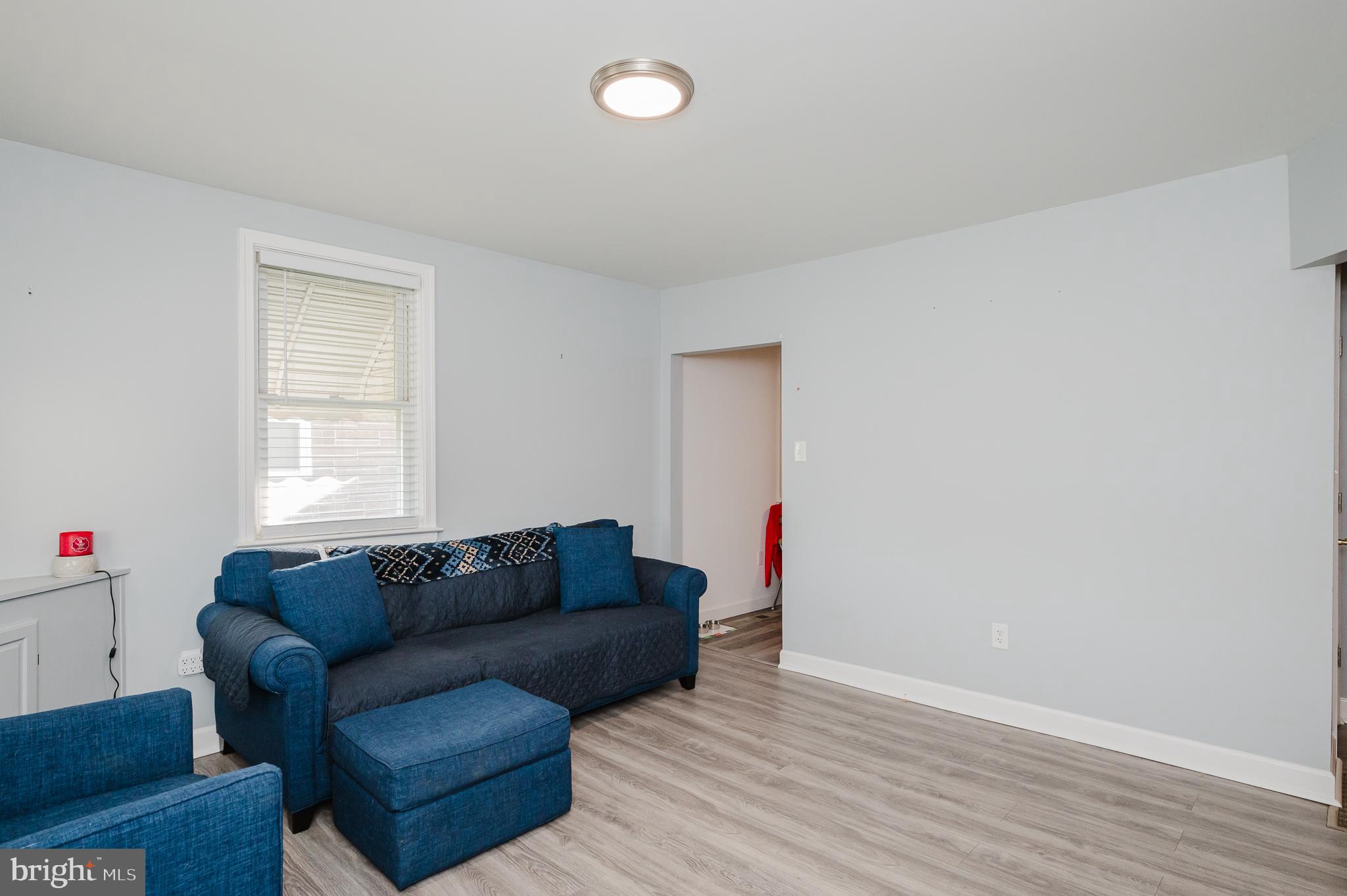 315 Pinewood Road Dundalk, MD 21222 - Photo 3 of 44 a living room with furniture and a window