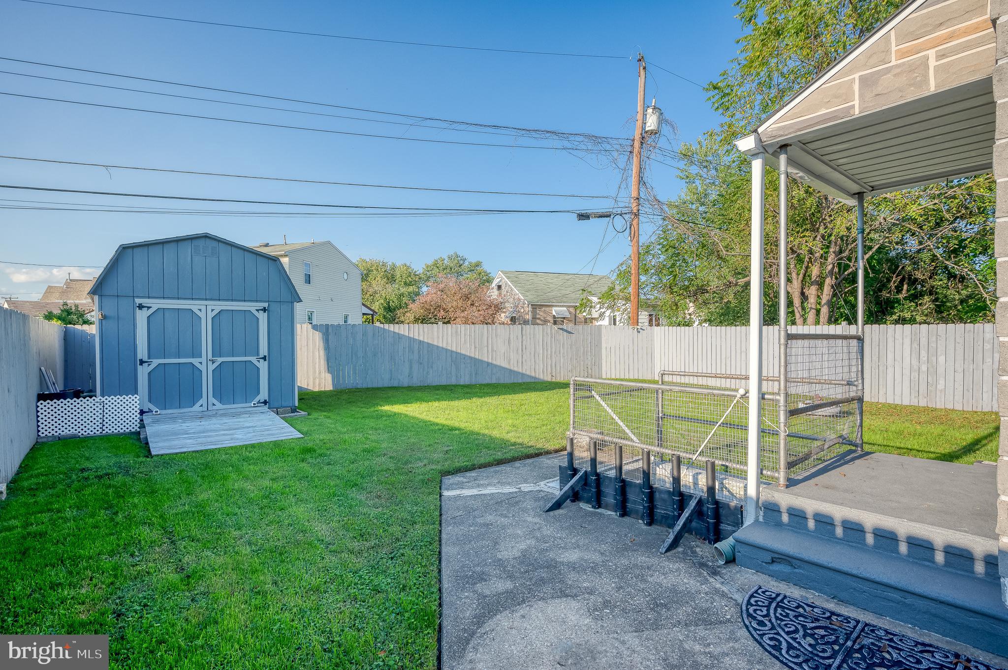 315 Pinewood Road Dundalk, MD 21222 - Photo 36 of 44 a view of a chair and table in backyard of the house
