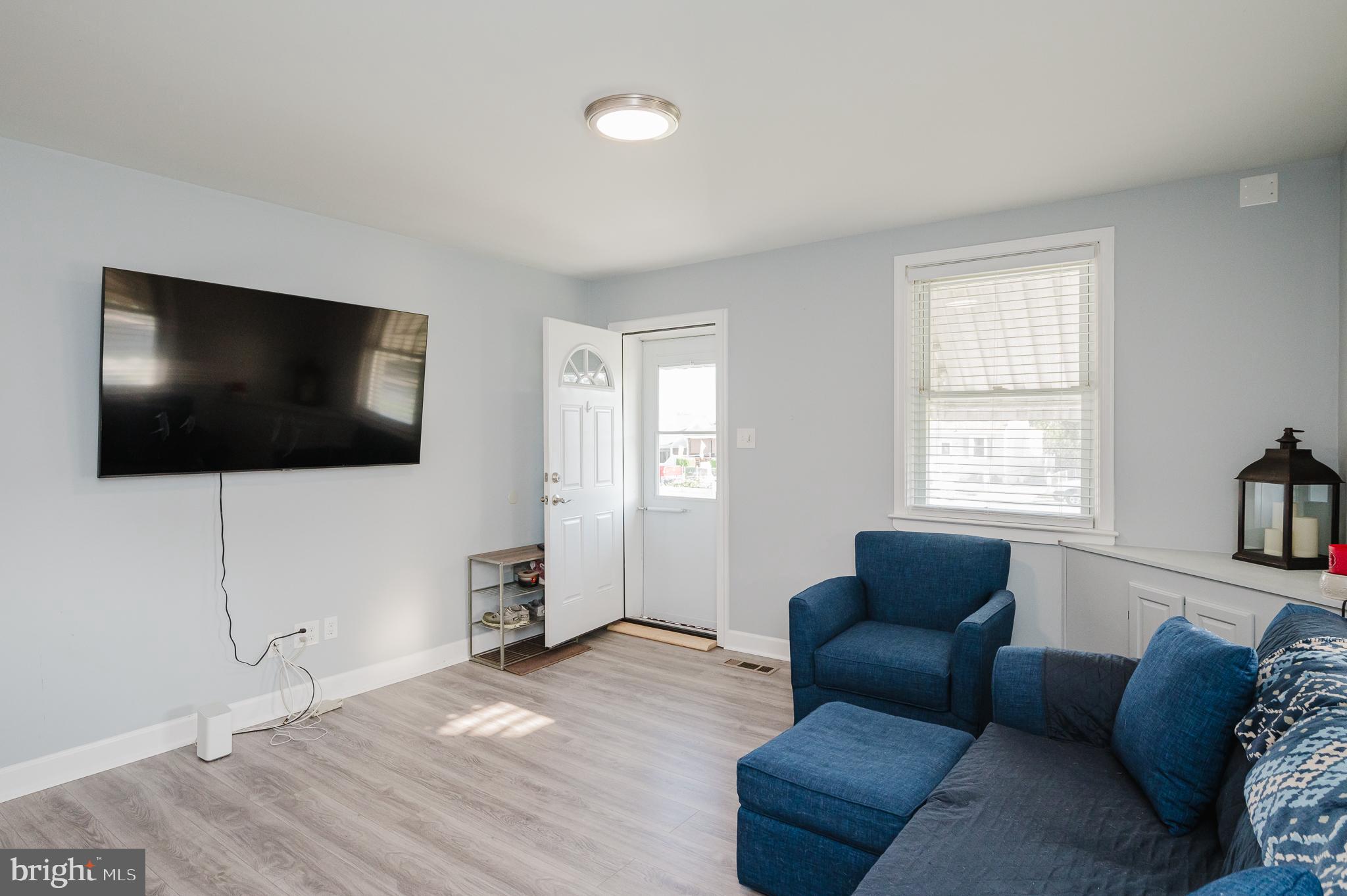 315 Pinewood Road Dundalk, MD 21222 - Photo 5 of 44 a living room with furniture and a flat screen tv