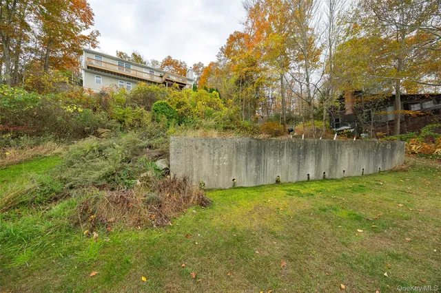 a view of a lake with a floor to ceiling window