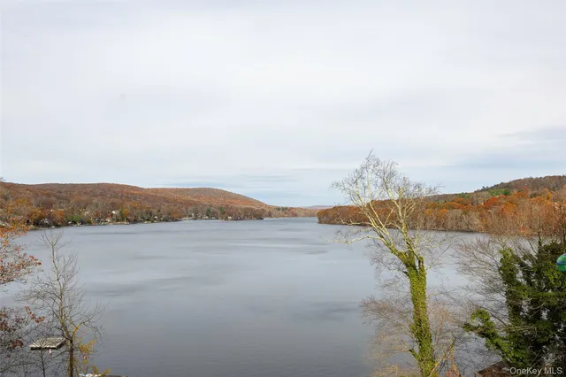 a view of a balcony with chair and wooden floor