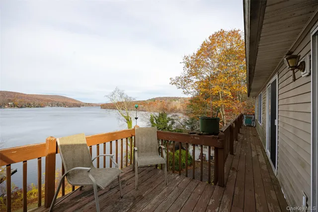 a kitchen that has cabinets a sink and appliances