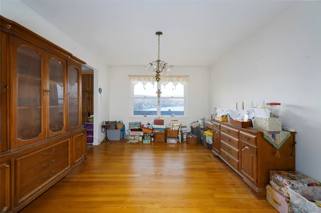 a bathroom with a sink toilet and window