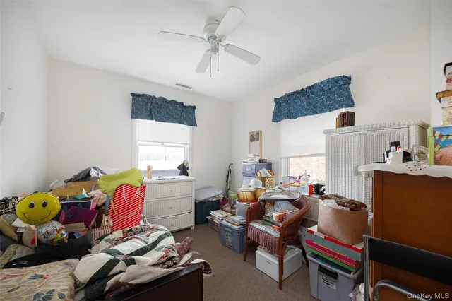 a work room with furniture and wooden floor
