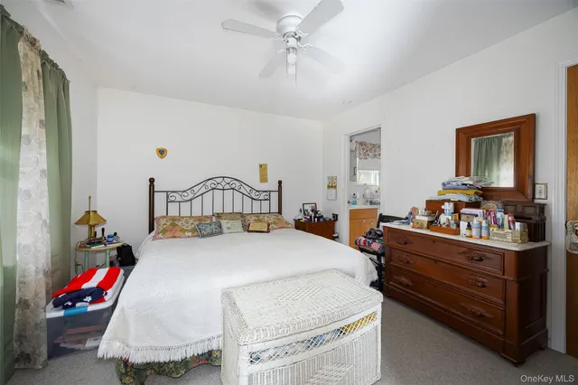 a bathroom with a sink mirror vanity and toilet