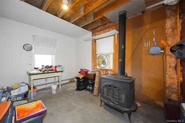 a bathroom with a sink vanity mirror and toilet
