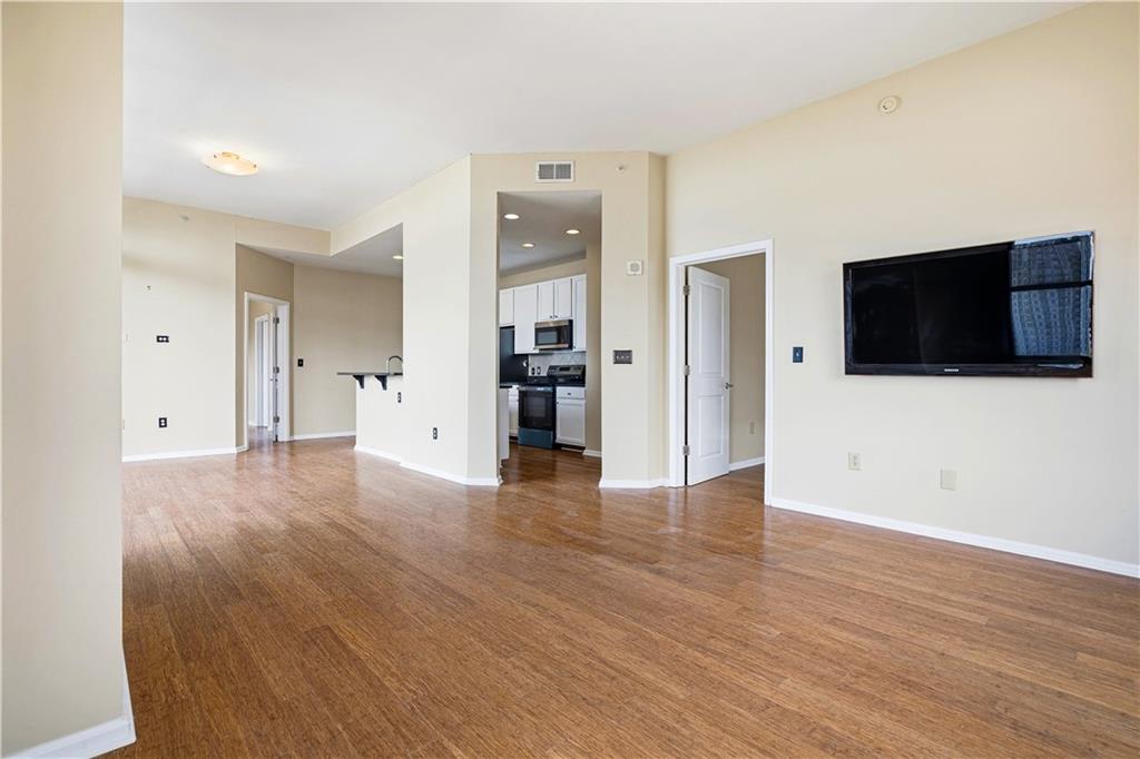 3040 Peachtree Road Northwest, Unit 1503 Atlanta, GA 30305 - Photo 12 of 38 a view of a livingroom with wooden floor