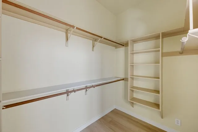 a view of an empty walk in closet