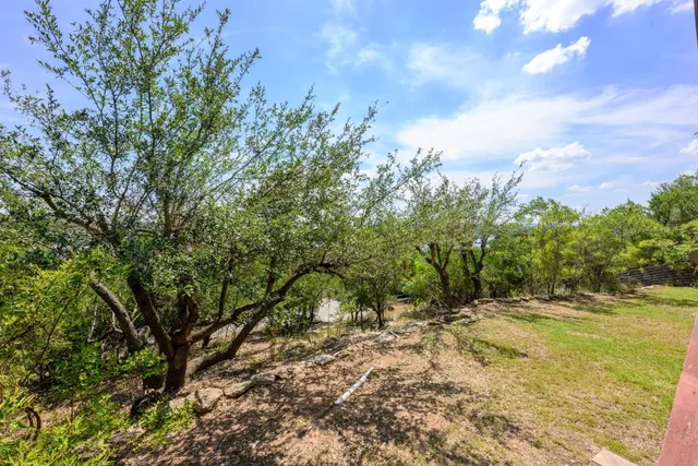 a view of a swimming pool with a yard
