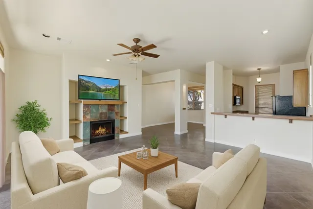 a living room with furniture and a fireplace