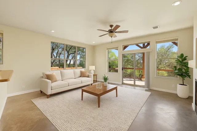a living room with furniture and a large window