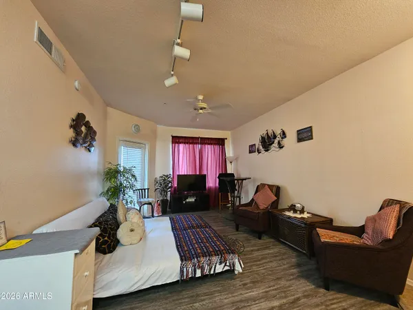 a living room with furniture and a window