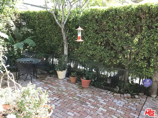 a view of a backyard with sitting area