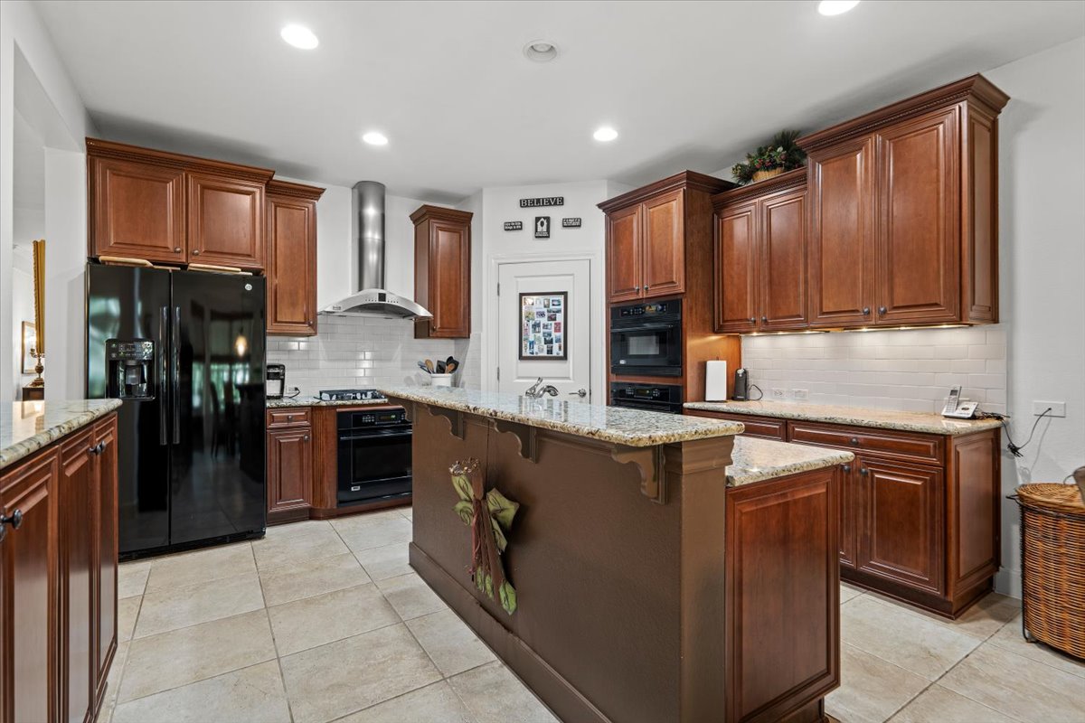 503 Breezeway Lane Georgetown, TX 78633 - Photo 10 of 38 Appliances (excluding refrigerator and dishwasher) are GE Monogram, including an Advantium speed oven/double oven and additional oven below the cooktop., offering added flexibility for cooking and entertaining.