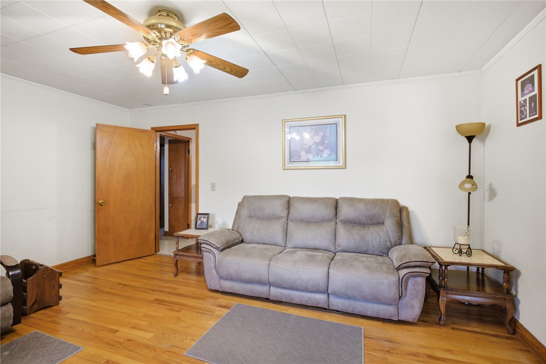 282 West Bennett Road Westminster, SC 29693 - Photo 4 of 42 This inviting living area features warm wood floors and a functional ceiling fan.