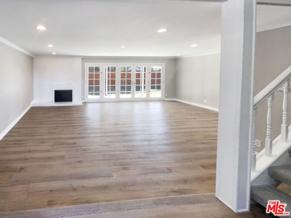 328 Valverde Avenue Brea, CA 92821 - Photo 4 of 21 a view of an empty room with wooden floor and a window