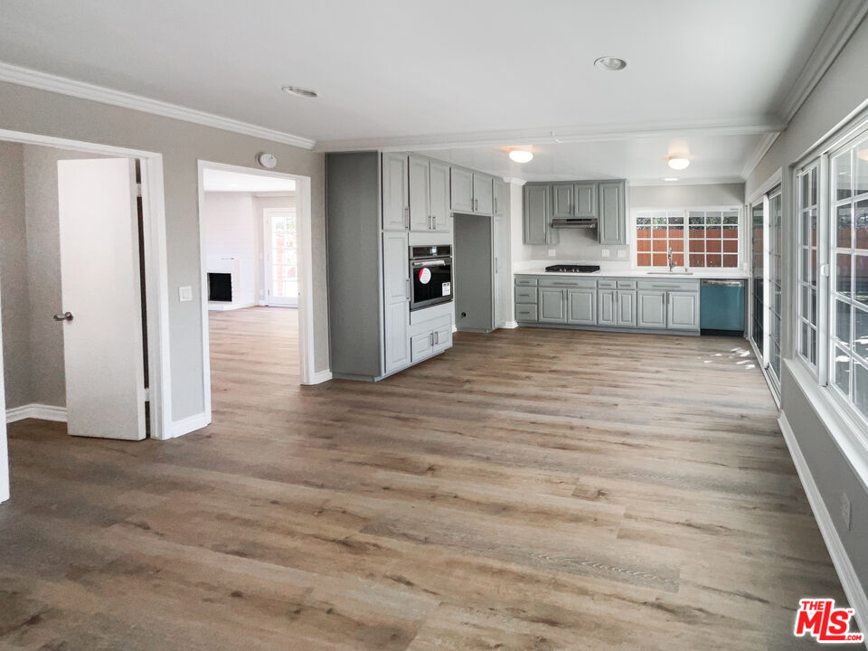 328 Valverde Avenue Brea, CA 92821 - Photo 9 of 21 a view of a big room with wooden floor and windows