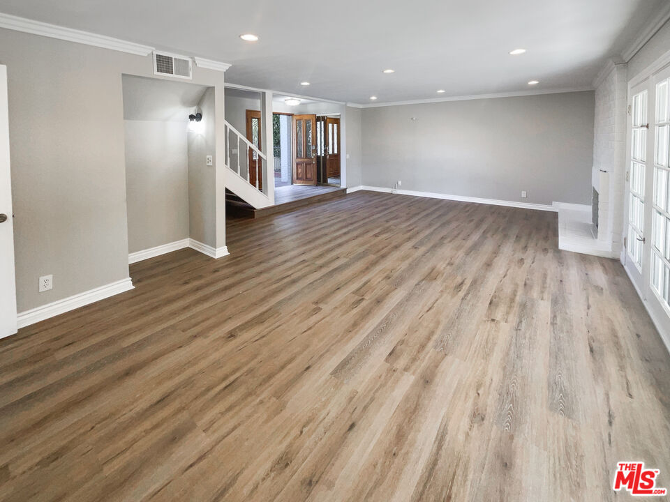 328 Valverde Avenue Brea, CA 92821 - Photo 10 of 21 an empty room with wooden floor and windows