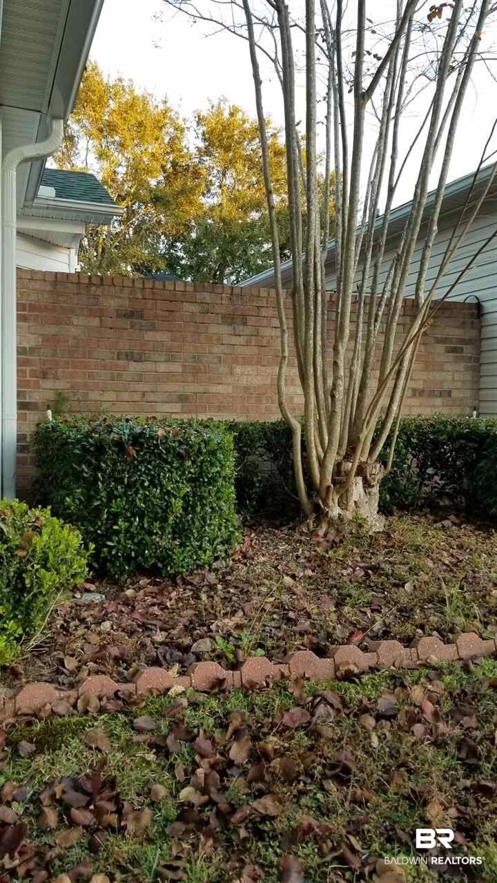 41 Cottage Drive Fairhope, AL 36532 - Photo 14 of 17 Brick wall for courtyard privacy