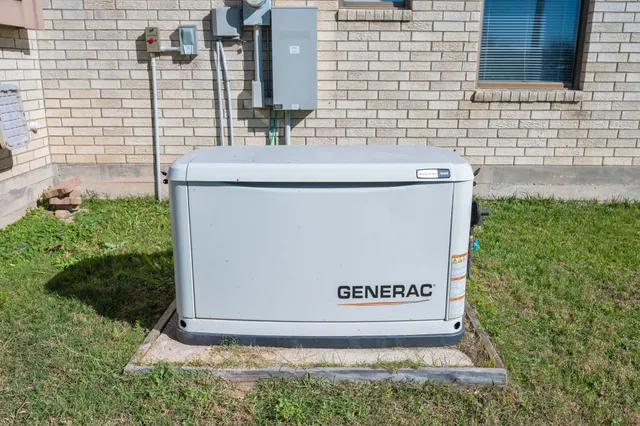 a sign that is on the side of a brick wall