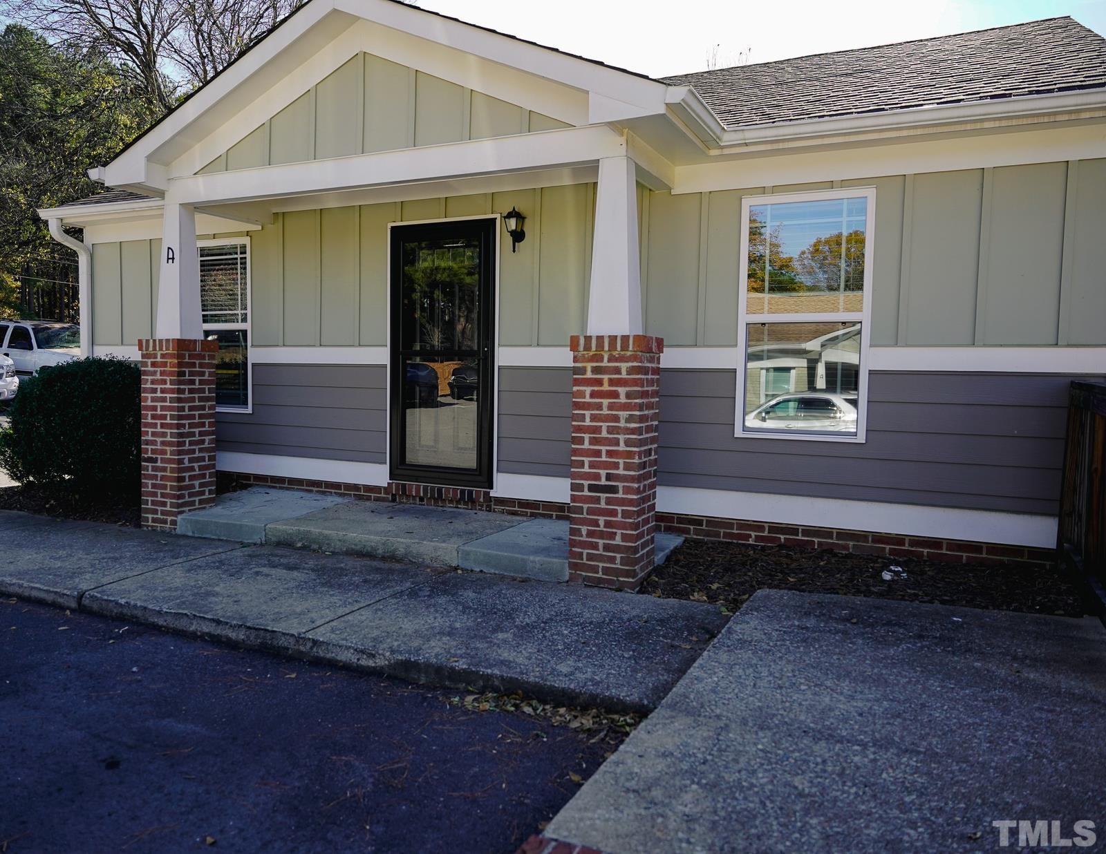 1320 South State Street, Unit A Raleigh, NC 27610 - Photo 2 of 20 a front view of a house with a yard